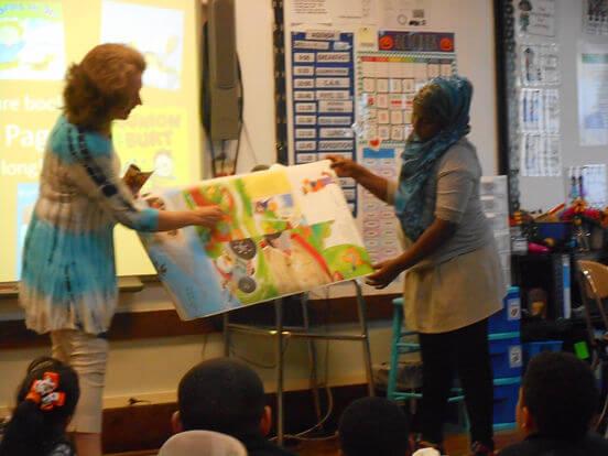 Author and student presenting a project from a workshop
